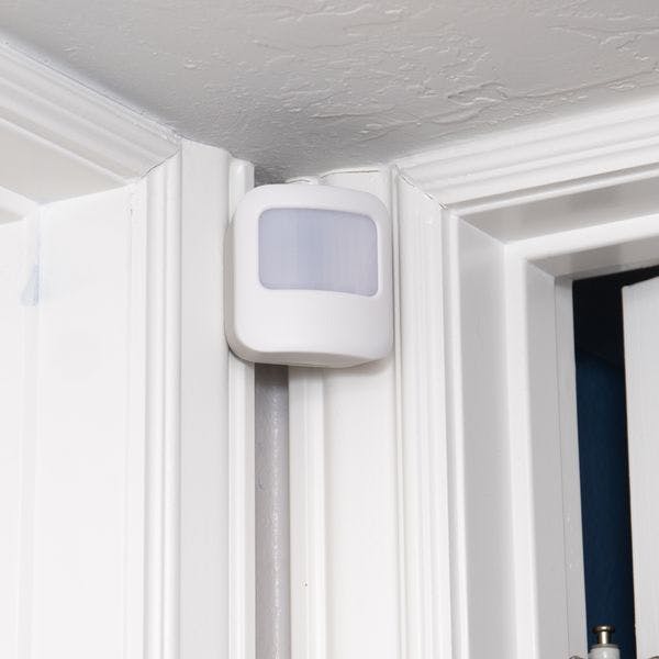 Vivint motion detector installed to two conjoining doorframes